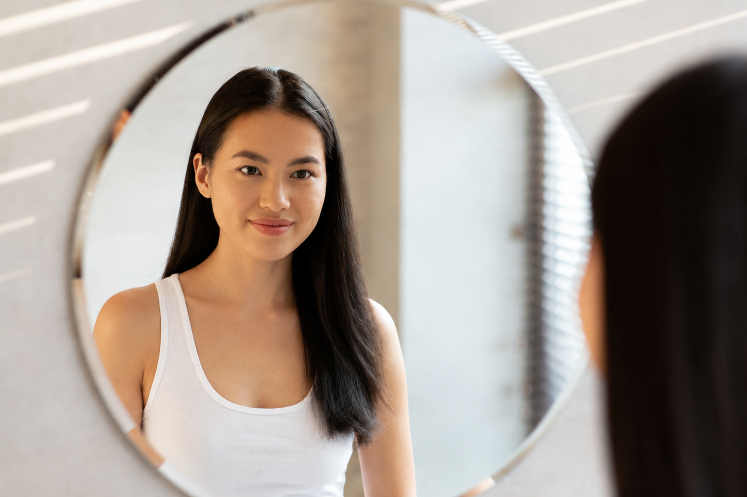 Woman checking hair fall after stopping hair growth serum with Redensyl and Anagain